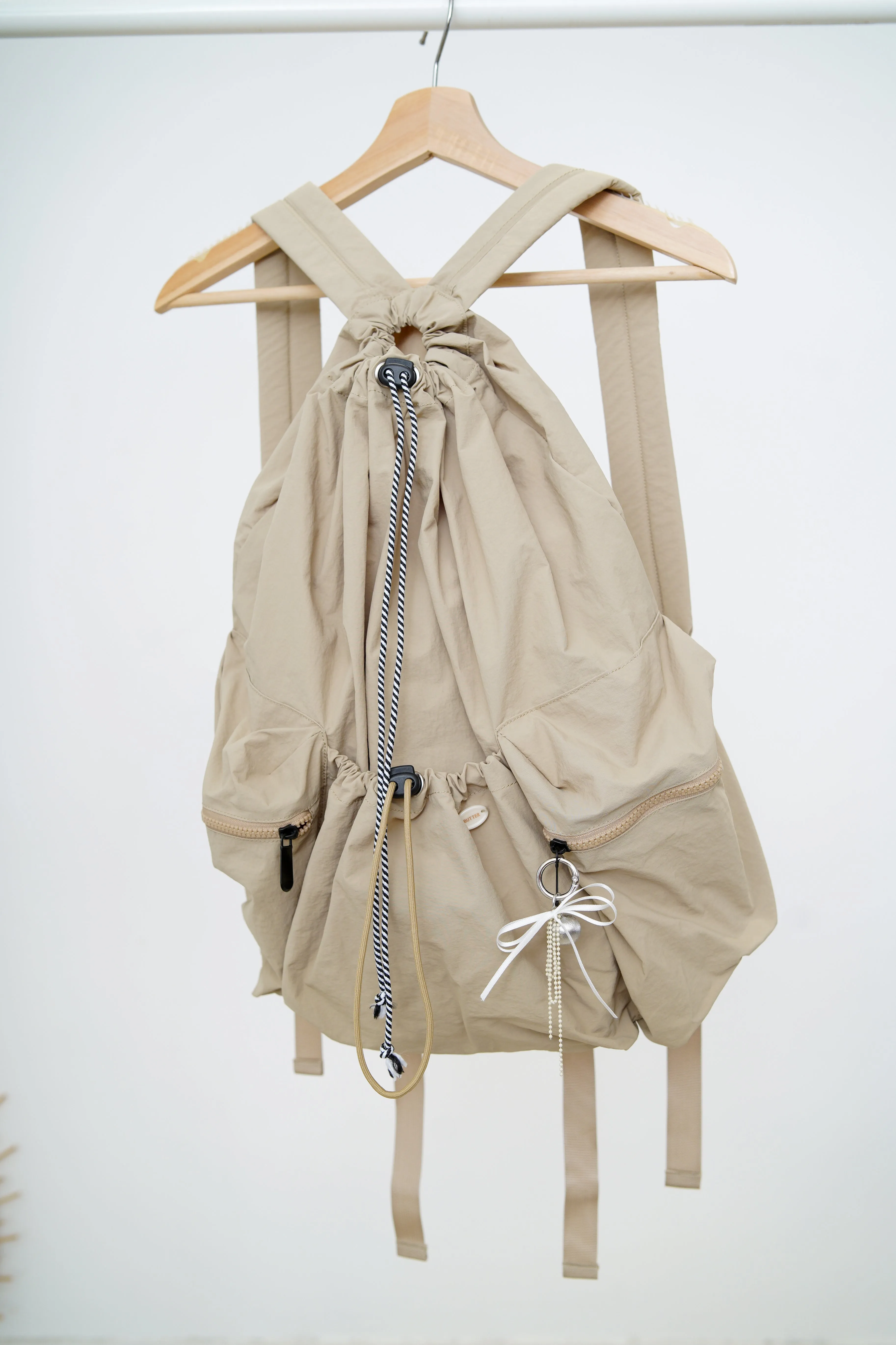 Beige drawstring backpack