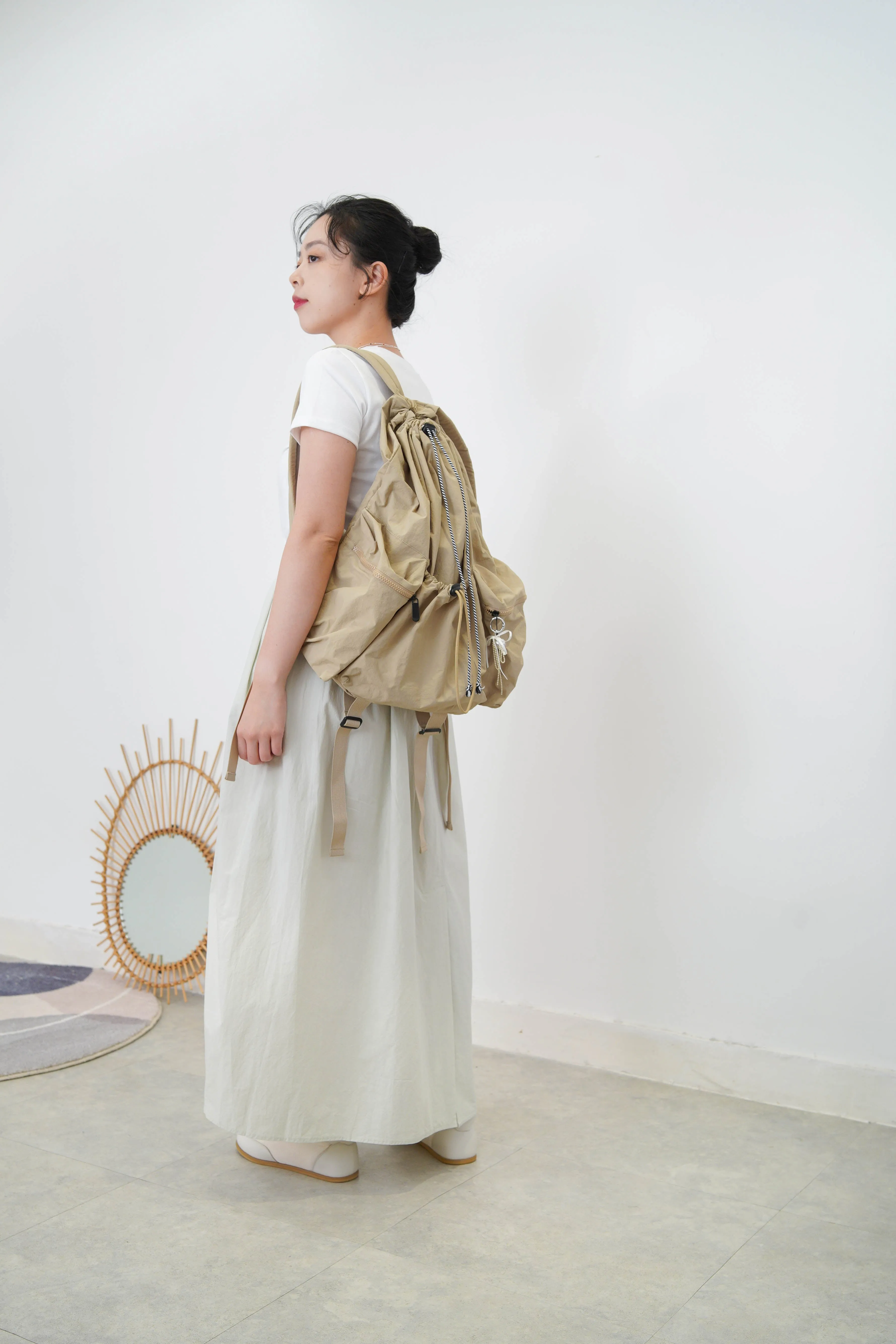 Beige drawstring backpack