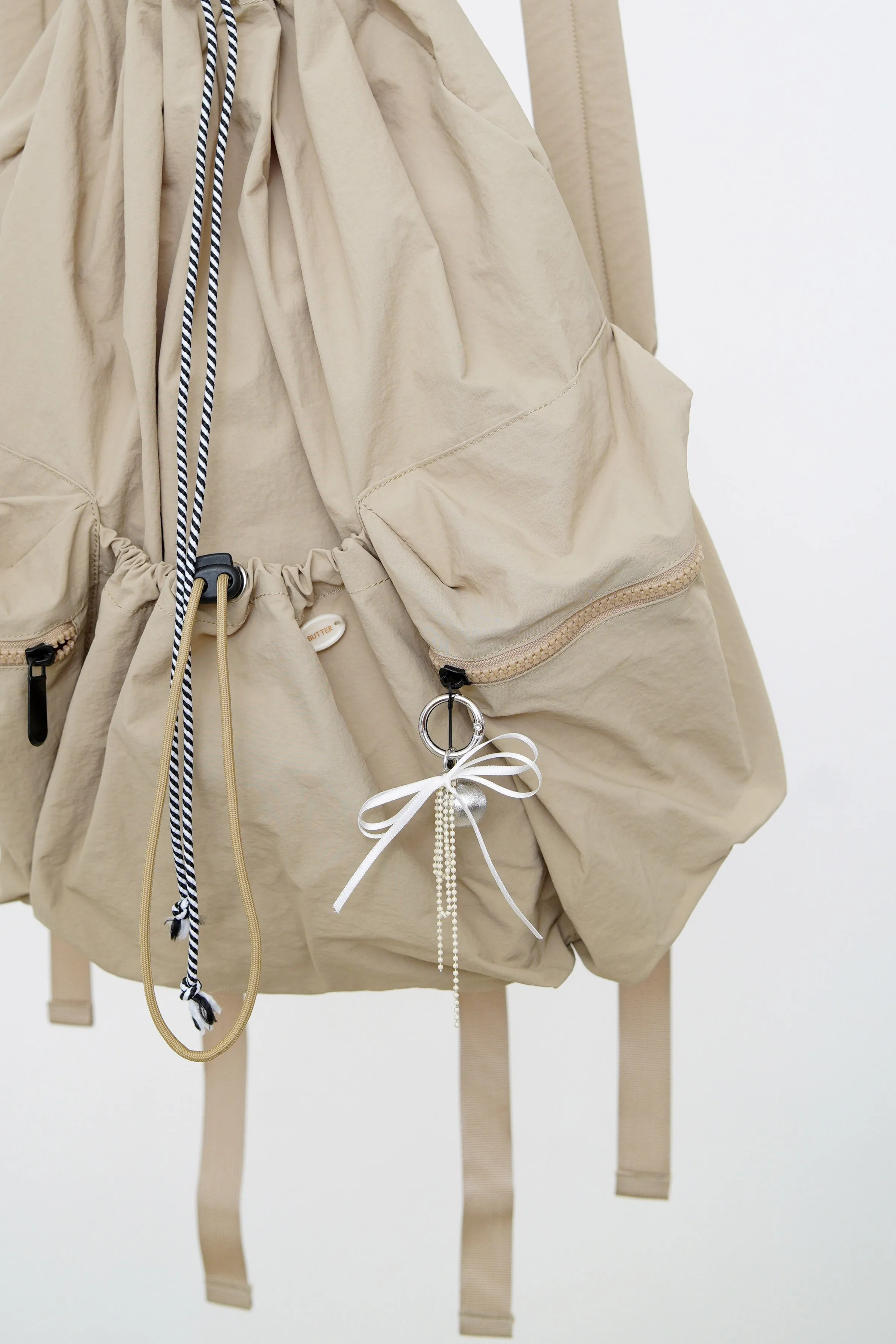 Beige drawstring backpack